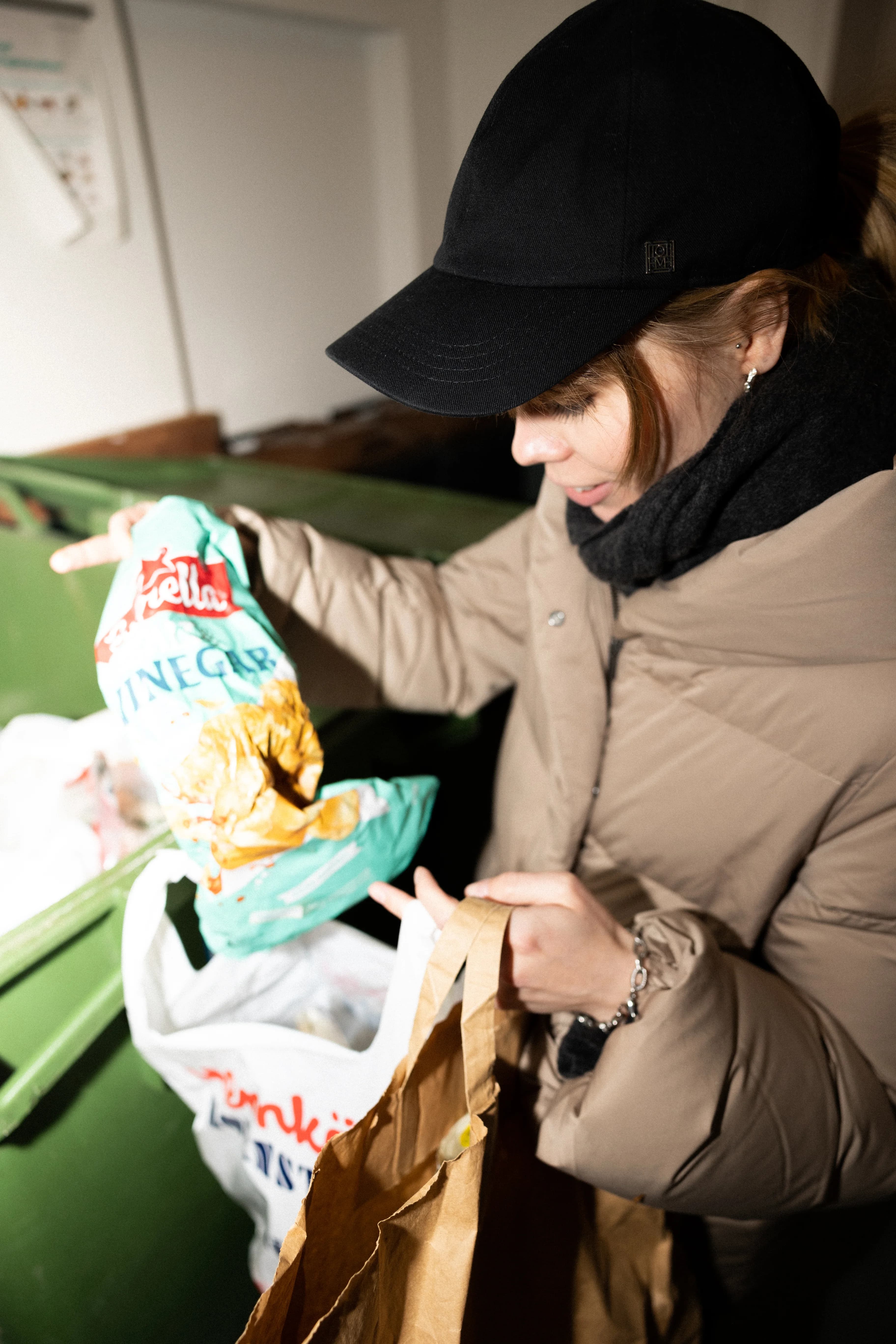 Woman recycling plastic